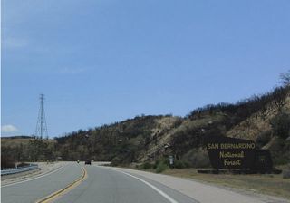 Immediately after the California 173 intersection, California 138 east enters San Bernardino National Forest.