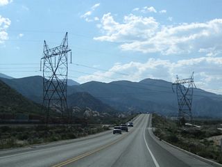 A pair of Los Angeles Department of Water and Power lines cross over California 138. These lines travel southwest toward Los Angeles and north toward a substation near Victorville.