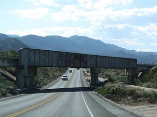 Westbound California 138 passes under another branch of the BNSF Railroad.