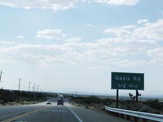 A bit further west, California 138 approaches Oasis Road (one-half mile) at a signalized intersection.