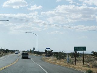 Near 263rd Street, California 138 leaves San Bernardino County and enters Los Angeles County and the unincorporated community of Llano. A change in postmiles advises that appropximately 74 of the total 105 extant miles of California 138 lie ahead in Los Angeles County. This mileage figure does not include the overlap with California 14 in Palmdale and Lancaster.