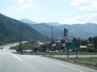 Westbound California 138 meets the on-ramp to Interstate 15 south to Ontario and Corona.