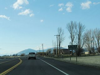 Northbound California 139 approaches Yost Road and Akins Road.