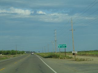 For the remaining distance east to Merced, California 140 will generally follow Bear Creek. The southern side of the highway may have less developed lands (including wetlands), while the north side has more agricultural development. Here, California 140 approaches Washington Boulevard.
