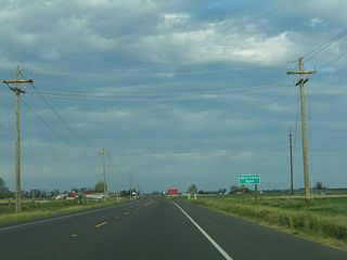 Several miles east (after passing the Joseph Gallo Dairy and Cheese Plant), California 140 approaches Bert Crane Road.
