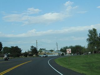 As California 33 and California 140 turn east around Harry Schmidt Park, the road changes from Jensen Road to South Avenue.