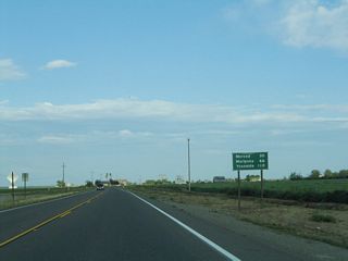 This mileage sign along California 140 east provides the distance to Merced (30 miles), Mariposa (66 miles), and Yosemite National Park (110 miles). California 140 ends at the west entrance to the national park as it follows the Merced River toward Yosemite Valley.