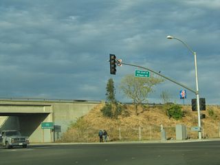 At California 99, eastbound California 140 turns southeast onto 13th Street, a frontage road that parallels the freeway. The frontage road leads California 140 southeast onto California 99 south.