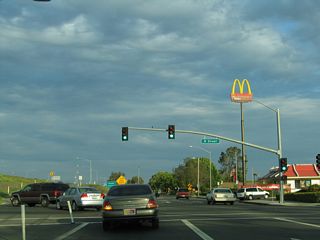 After passing by R Street, eastbound California 140 merges onto California 99 south. The two state routes merge only briefly; the second exit on California 99 south allows California 140 to depart the freeway.