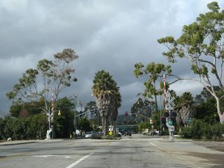 After Calle Puerto Vallarta, northbound Milpas Street crosses the railroad track (which carries the Amtrak Coast Starlight and commercial rail traffic) and proceeds toward a junction with U.S. 101 (El Camino Real).