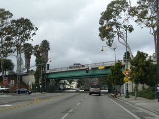 Milpas Street prepares to pass under the U.S. 101 freeway in downtown Santa Barbara. After this bridge, Milpas Street will enter a roundabout, which is where California 144 used to originate before it was removed from Milpas Street and Montecito Street.