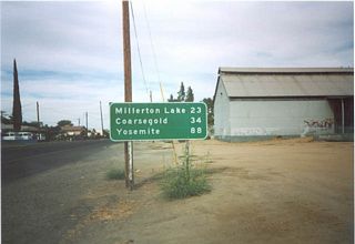 This mileage sign is found on California 145 upon leaving Madera. Millerton Lake is the next town, 23 miles north of Madera.