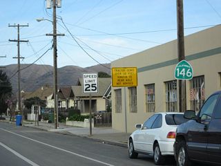 This California 146 east reasssurance shield is located along East Street after separating from U.S. 101 Business (Front Street) in Downtown Soledad. From here, California 146 travels east from here to the west entrance of Pinnacles National Monument. It does not connect to California 25 or the east entrance of Pinnacles National Monument.