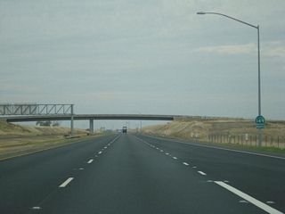 Leaving the Wicks Corner Interchange, this California 149 north reassurance shield is posted as the four-lane expressway proceeds northwest between California 70 and California 99. California 149 essentially functions as a freeway, with the exception of one at-grade intersection.