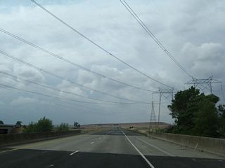 California 149 crosses over Clear Creek and below the 500kV power lines on a 1975 bridge. The southbound lanes are on a bridge built in 2008.
