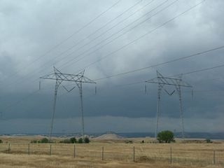 Looking south, these 500kV power lines run together to the Table Mountain substation, then proceed south until separating at Sutter Buttes. One line leads southwest toward the Vaca-Dixon substation off Interstate 80, then proceeds south to the Tesla substation. The other skirts Sacramento and Davis, connecting to the grid again at the Tracy and Tesla substations. South of Tesla substation, the 500kV power lines continue along Path 15 to the Los Banos, Gates, and Midway substations.