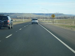 The lanes of southbound California 149 merge with the transition ramp from California 99 north to California 149 south.