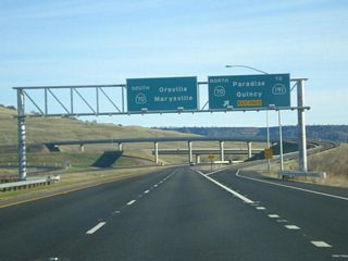 Southbound California 149 meets Exit 1B, California 70 east to Quincy and California 191 north to Paradise. The left two lanes default onto California 70 south to Oroville via Exit 1A.