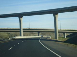 Southbound California 149 passes under the transition ramp from California 70 west to California 70 south.