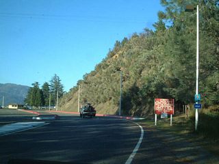 Although unsigned, California 151 comes to its end at the Shasta Lake dam visitors center parking lot.