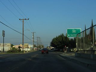 Eastbound SR 155 (Garces Highway) begins in the city of Delano at the RIRO ramps (Exit 56) connecting SR 99 with 9th Avenue. SR 155 follows the frontage streets to the freeway south four blocks to Garces Highway, which leads the route east from SR 99.