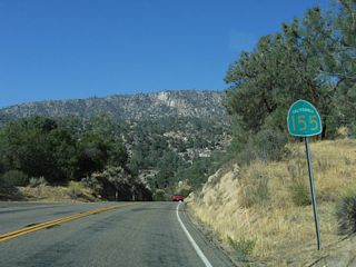 SR 155 curves southwest by French Gulch beyond this reassurance shield.