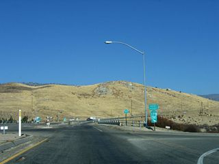 The first confirming marker for SR 155 westbound stands north of the entrance ramp for SR 178 east.
