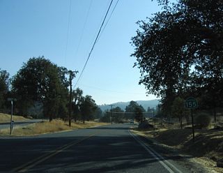SR 155 turns westward again from Grantie Road to the south of Blue Mountain and Blear Hollow.