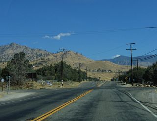 Old State Road ties into SR 155 from the adjacent Live Oak campground and across from Tillie Creek campground along Isabella Lake. The former alignment of SR 155, Old State Road navigates along a circuitous route across the hills overlooking Wooford Heights to the west.