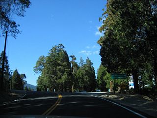 The next intersection beyond Greenhorn Mountain County Park from Sr 155 west is with Rancheria Road south to the unincorporated community of Shirley Heights. SR 155 reaches its highest point here at Greenhorn Summit, elevation 6,102 feet.