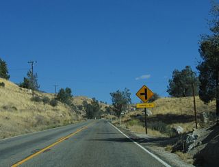 Northbound of Sawmill Road, SR 155 follows Wofford Boulevard into the unincorporated community of Wofford Heights.