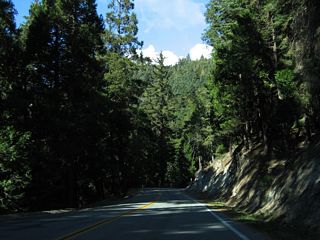 SR 155 travels north from Greenhorn Mountain County Park to Spout Spring, then turns southward alongside Slick Rock Creek.