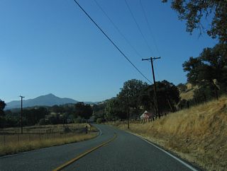 Parallleing Fulton Creek, SR 155 turns southwest around Fulton Peak through a broader valley where the Sequuoia National Forest Fulton Work Center is located.