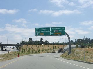 Upon exiting U.S. 101 (El Camino Real) south at Exit 335, California 156 continues southwest toward the Monterey Peninsula. On the transition ramp, the left lane carries California 156 west to Monterey, while the right lane connects to Prunedale Road east to U.S. 101 north. The reason U.S. 101 north is signed here is because some side traffic is required to use U.S. 101 south to access U.S. 101 north due to its expressway configuration near Prunedale.