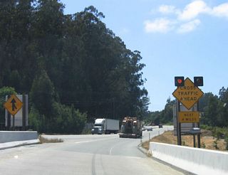 California 156 west reduces to a two-lane conventional highway, with cross traffic ahead for the next four miles. This section of highway is generally very busy, as it is one of the major routes to Monterey. There is no direct freeway connection to the Monterey Peninsula, even though California 1 is a freeway through Monterey. California 1, California 68, and California 156 all have two-lane segments on their way to the peninsula.