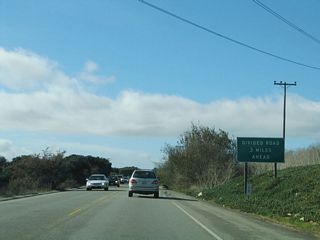 California 156 will widen to expressway standards in three miles. The postmile indicates that only five miles of California 156 west remain (until the interchange with California 1 (Cabrillo Highway) at the coast). The distance to Seaside, Monterey, and Pacific Grove is a bit further, since a bit of travel south on California 1 is required.