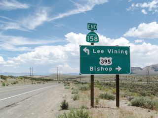 Northbound SR 158 (June Lake Loop) at U.S. 395/SR 120. U.S. 395/SR 120 overlap north to Lee Vining Turn. U.S. 395 continues from there to Mono Lake and Bridgeport. Beyond their nearby separation, U.S. 395 leads south to Mammoth Lakes and Bishop while SR 120 travels east to U.S. 6 in Benton.