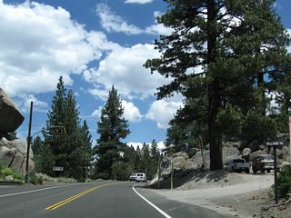 SR 158 at Hillside Road and the June Lake Fire Department A balanced rock sits on the west side of the highway next to the fire house.