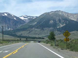 California 158 proceeds southwest toward Grant Lake. For the next five miles, snow slides can occur during winter months. Ahead is a gate that is used to close the highway during the winter.
