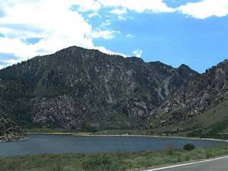 California 158 continues around the southwestern edge of Grant Lake, then enters a small aspen grove west of Reversed Peak.
