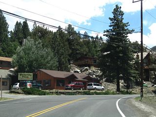 Following Reversed Creek, SR 158 heads east by a number of resorts north of Carson Peak. This creek drains June Lake and Gull Lake, connecting to Rush Creek south of Silver Lake. Power lines  along the highway bring hydroelectric power from the Rush Creek Hydroelectric Project (first operation in 1916) into the power grid.