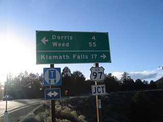 U.S. 97 heads north into Oregon ahead of Lake Miller. The highway continues north to Klamath Falls.