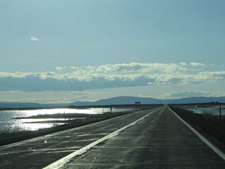 With wetlands on both sides of the state highway, it is doubtful that this road would be built given strict environmental concerns today. However, California 161 offers an unparalleled view of a major wetland preserve.