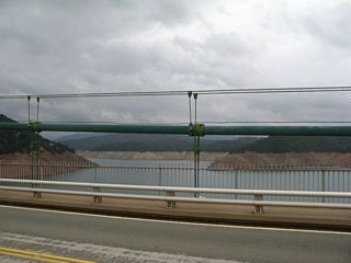 The new Bidwell Bar Bridge was needed once Oroville Dam was built, as the new Lake Oroville would overwhelm and inundate the original Bidwell Bar Bridge. The original suspension bridge crossing the Middle Fork of the Feather River dated back to the 1850s.