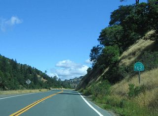 A California 162 reassurance shield is posted after the Rodeo Creek bridge.