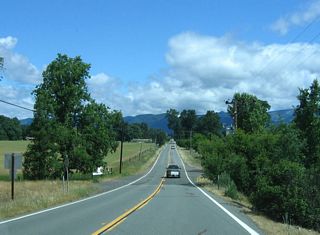After the climb and descent from Poonkinny Ridge, California 162 lands in the Round Valley, traveling due north now toward the town of Covelo. A good portion of the northern Round Valley is part of the Round Valley Indian Reservation.