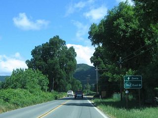 California 162 turns east again at this intersection; turn right to follow California 162 (via Mendocino Pass Road) or continue straight ahead to Zenia via Mina Road.