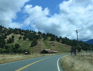 Reaching the end of the Round Valley, California 162 passes by a farm house and prepares to reach its end. California 162 ends at the Short Creek bridge (built in 1962), which is signed with an end shield.