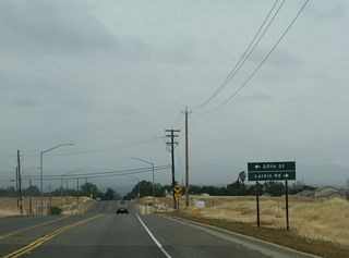 Soon thereafter, eastbound California 162 approaches the intersection with 20th Street and Larkin Road. California 162 starts to see residential development as it enters the outskirts of Oroville.