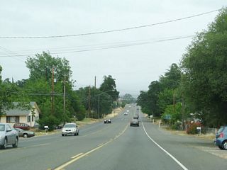 California 162 sees residential development as the state highway approaches Harlan Avenue.